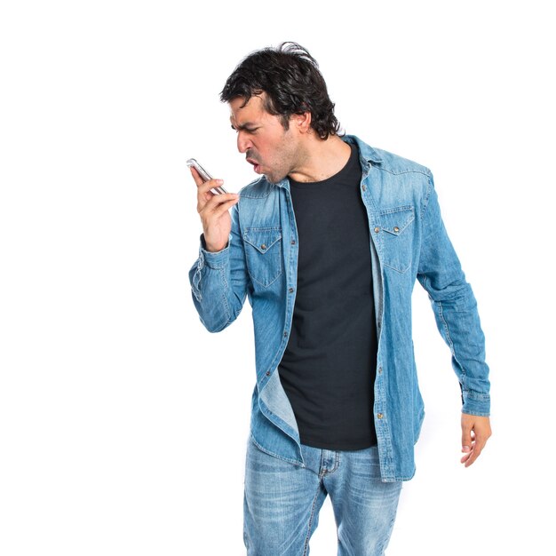 Man shoutting by mobile over white background