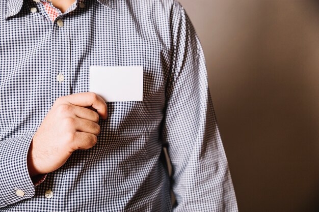 Man showing business card