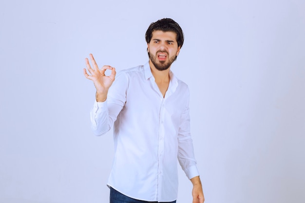 Man showing enjoyment sign in a circle form.