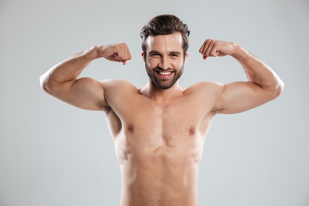 Man showing his biceps and looking at camera