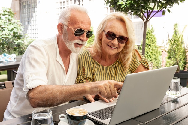 Man showing to laptop to his woman