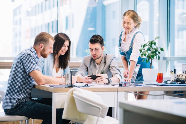 Man showing new strategy to colleagues