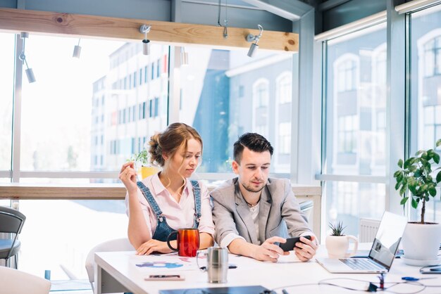 Man showing new strategy to woman