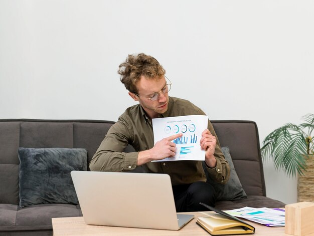 Man showing some infographics in a video call