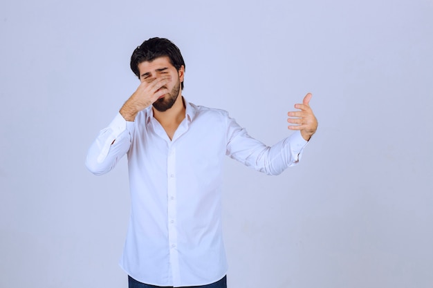 Man showing thumb up hand sign.