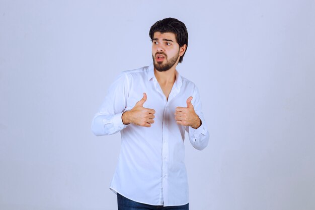 Man showing thumb up hand sign.