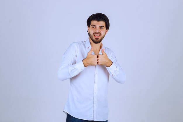 Man showing thumb up hand sign.