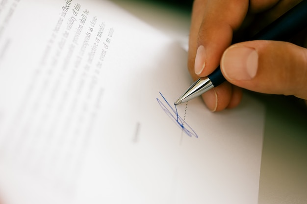 Man signing a contract