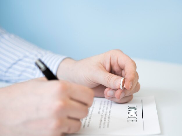 Man signing divorce contract