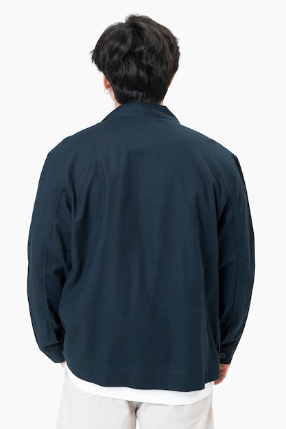 Free photo man in simple navy jacket portrait street fashion rear view