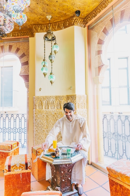 Man sitting in arab restaurant