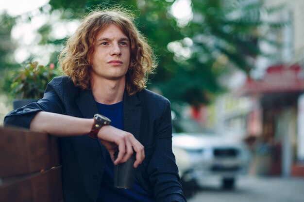 Man sitting on bench thinking