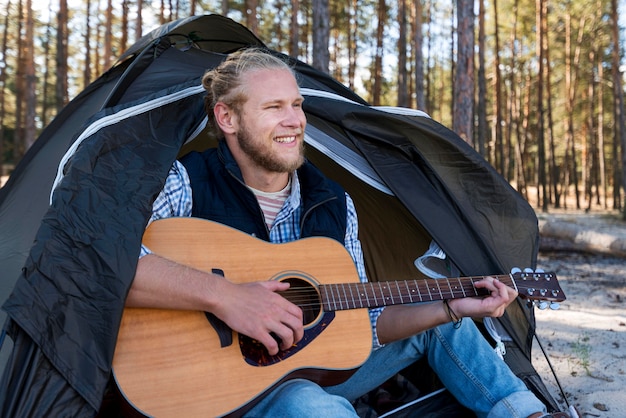 Man sitting and playing guitar