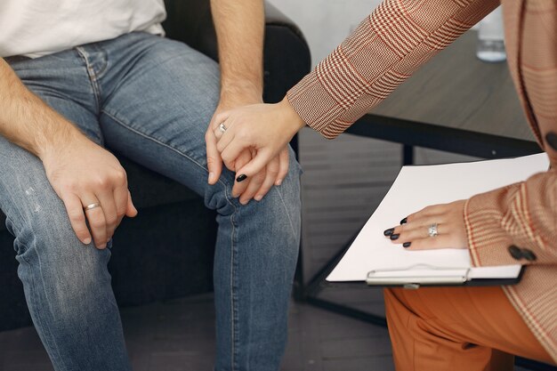 Man sitting in the psychologist's office and talking about problems