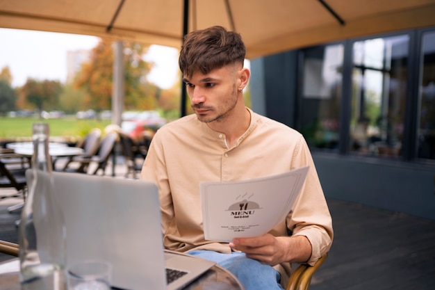 Man sitting at restaurant front view