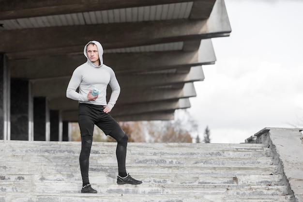 Man sitting on stairs and posing fashion