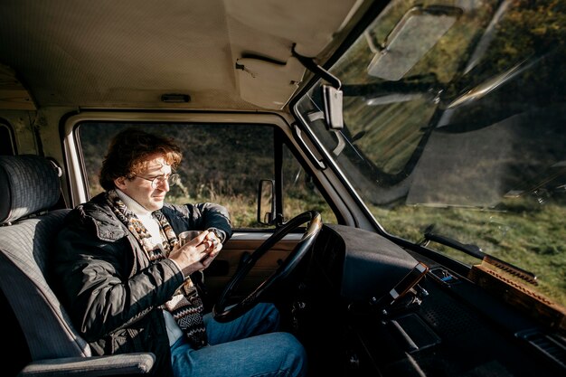 Man sitting in a van and looking outside