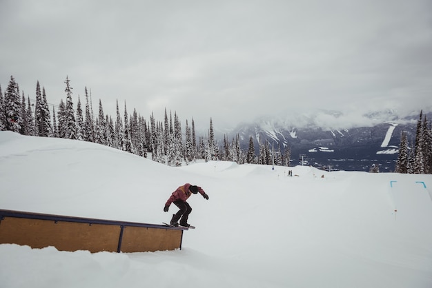 Man skiing on snowy alps in ski resort