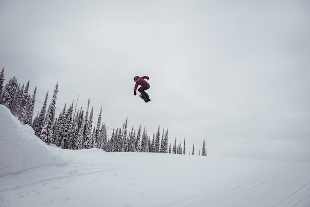 Man skiing on snowy alps in ski resort