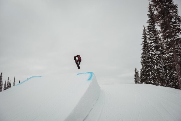 Man skiing on snowy alps in ski resort