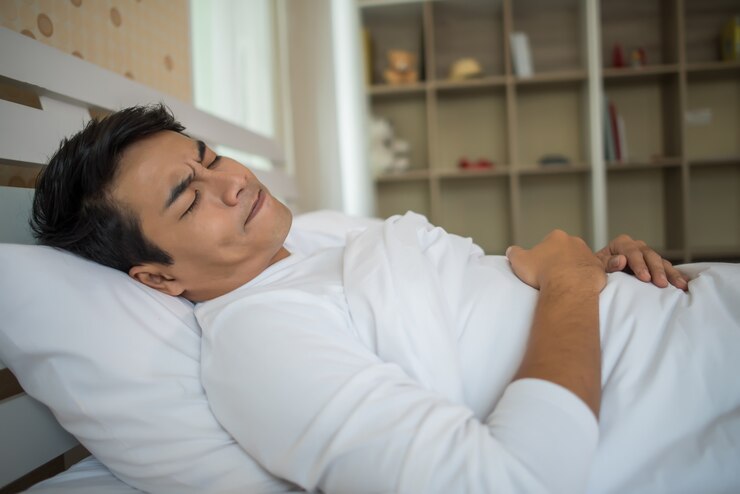 Free Photo man sleep in the bedroom
