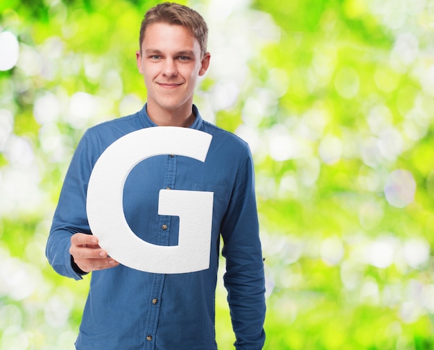 Man smiling holding the letter 