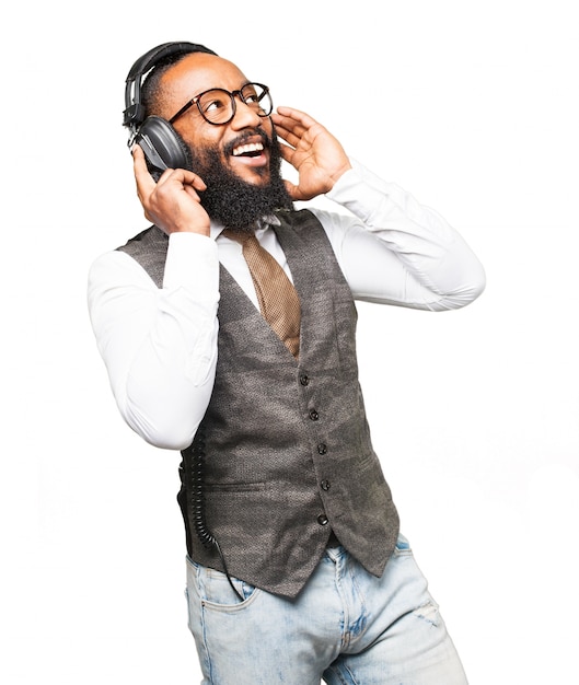 Man smiling and listening to music with headphones
