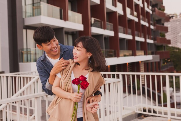 Man smiling and looking at his girlfriend