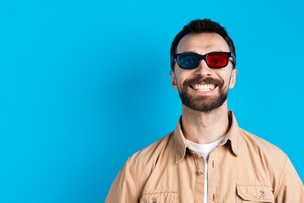 Man smiling while wearing glasses for movie