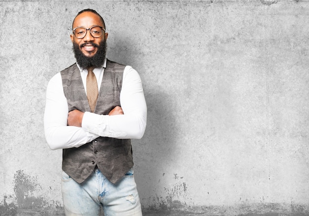 Man smiling with arms crossed