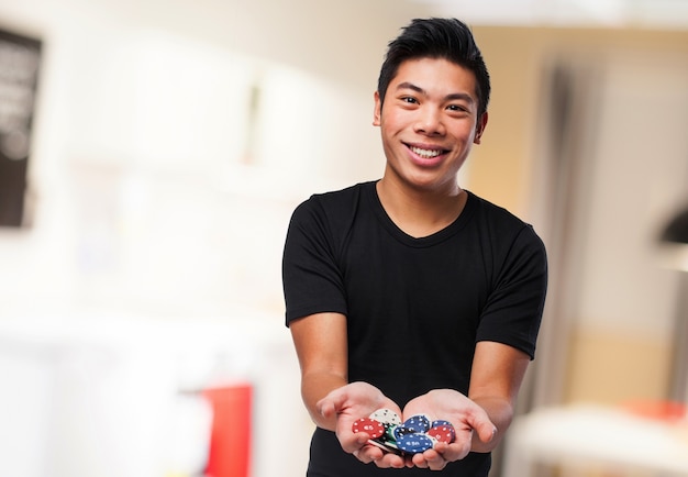 Man smiling with casino chips