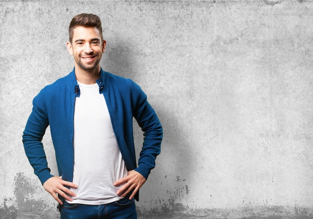 Man smiling with hands on hips