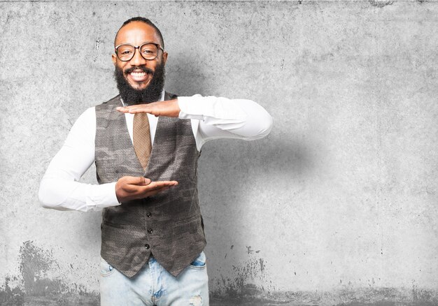 Man smiling with hands indicating a measure