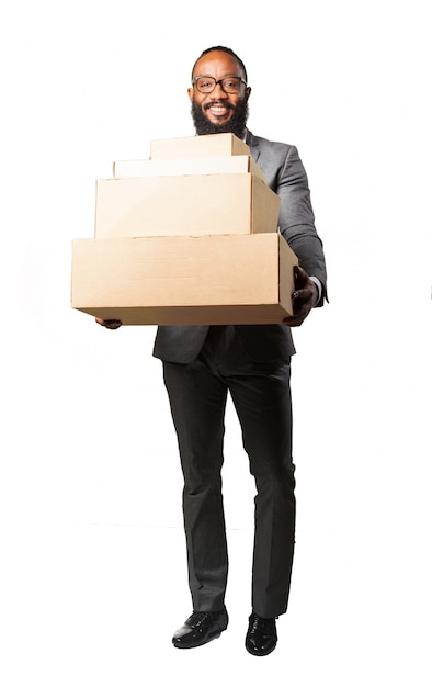 Man smiling with lots of boxes