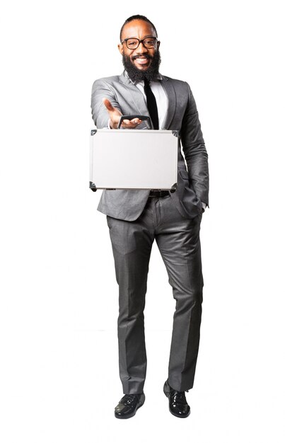 Man smiling with suit and suitcase