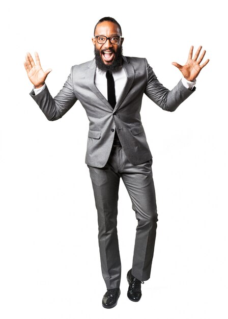 Man smiling with suit with hands up