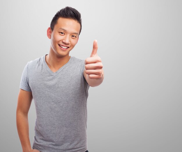 Man smiling with thumb up