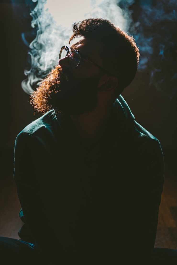 Free Photo man smoking cannabis