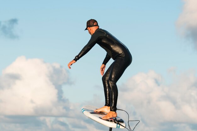 Man in special equipment surfing in hawaii