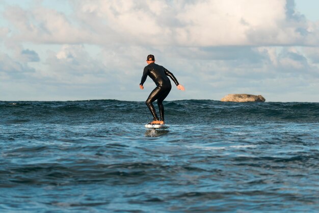 Man in special equipment surfing in hawaii