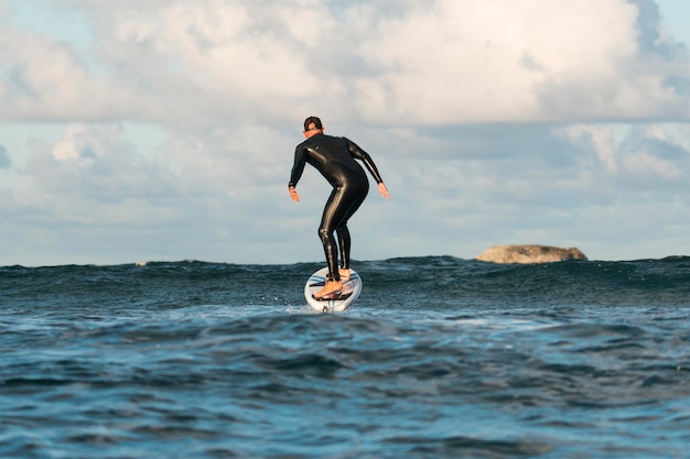 Man in special equipment surfing in hawaii