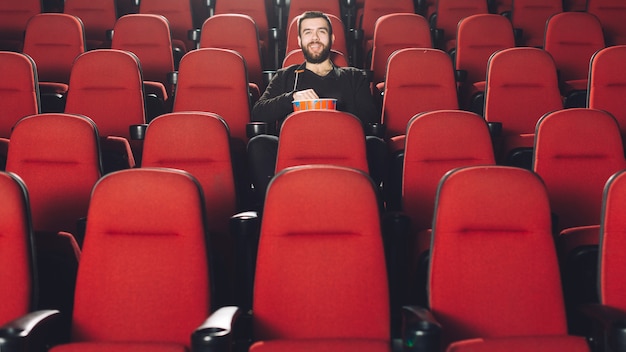 Man spending time in cinema