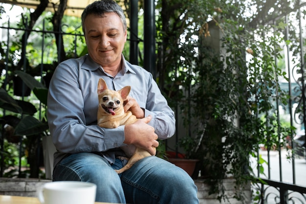 Man spending time with his dog in the garden