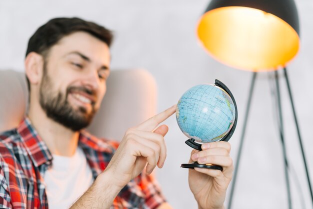 Man spinning globe