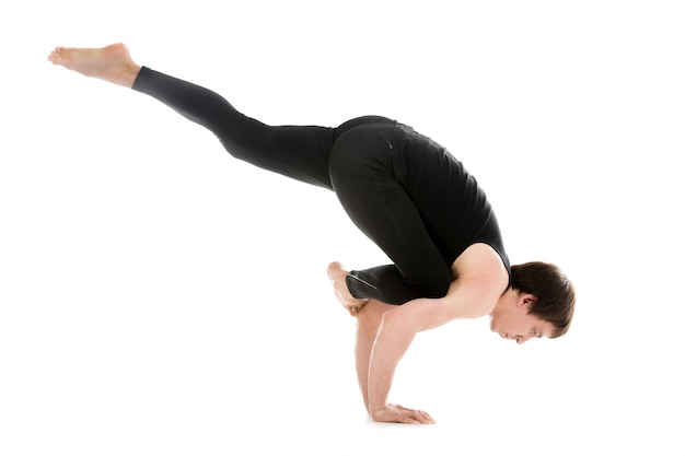 Man in sportswear practicing yoga