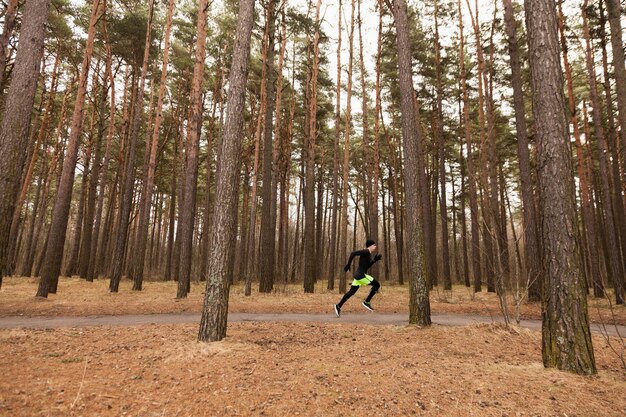 Man sprinting in forest