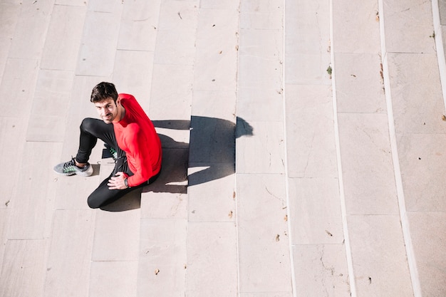 Man on stairs looking at camera