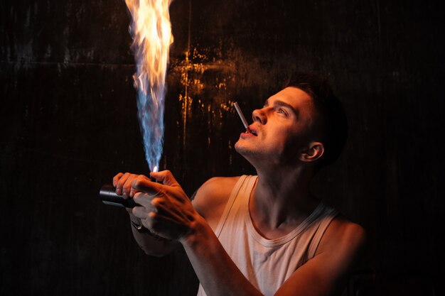 Man standing on floor with gas spray and cigarette