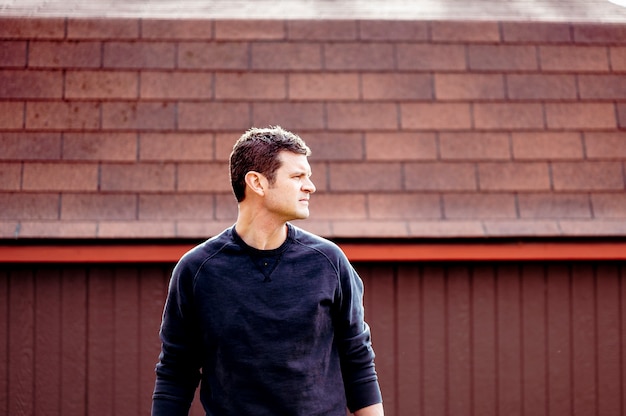 man standing in front of garage