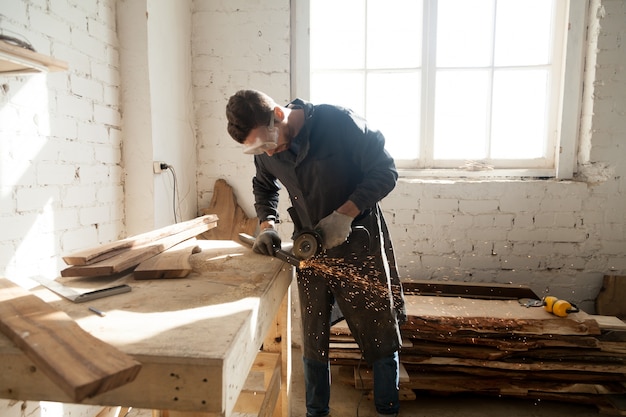 Man starting own small business in home workshop